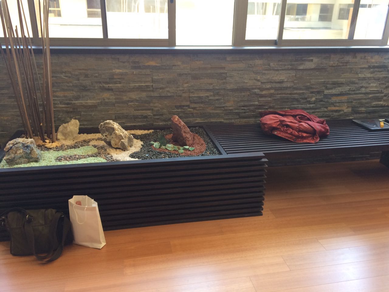 Bench with slatted base and indoor planter