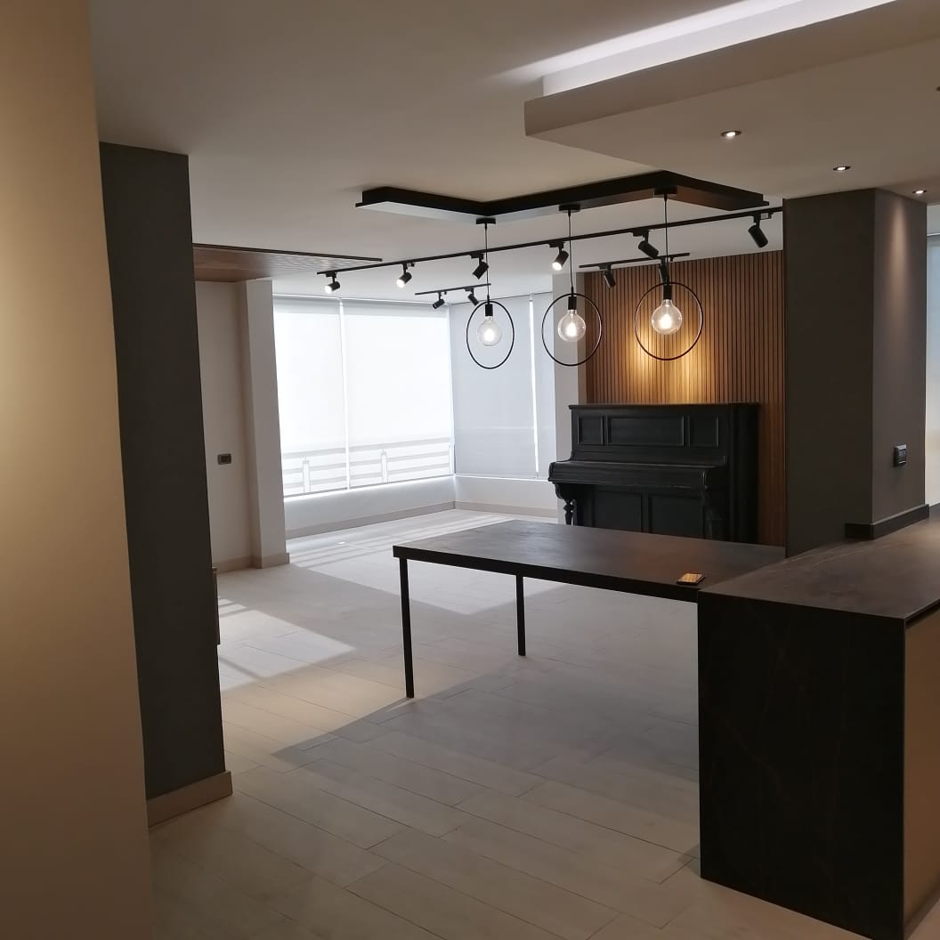 Living area detail with lighting and slatted panel