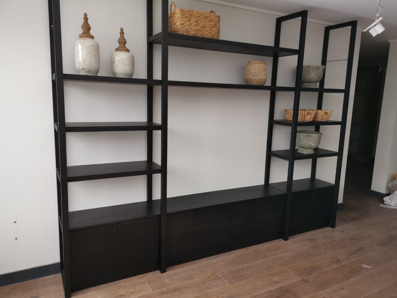 Black shelving system with cabinets